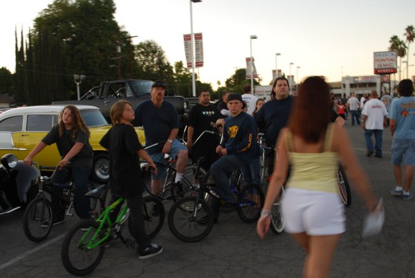 Bicycle riders cars